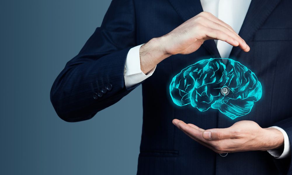 Businessman Holding Brain Diagram