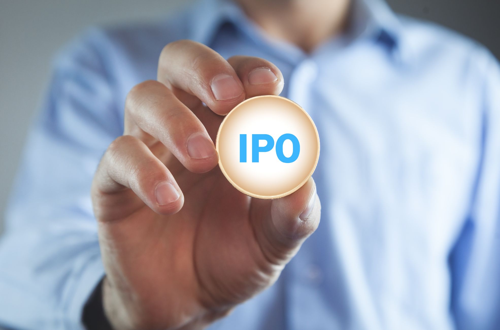 Businessman Holding IPO Sign