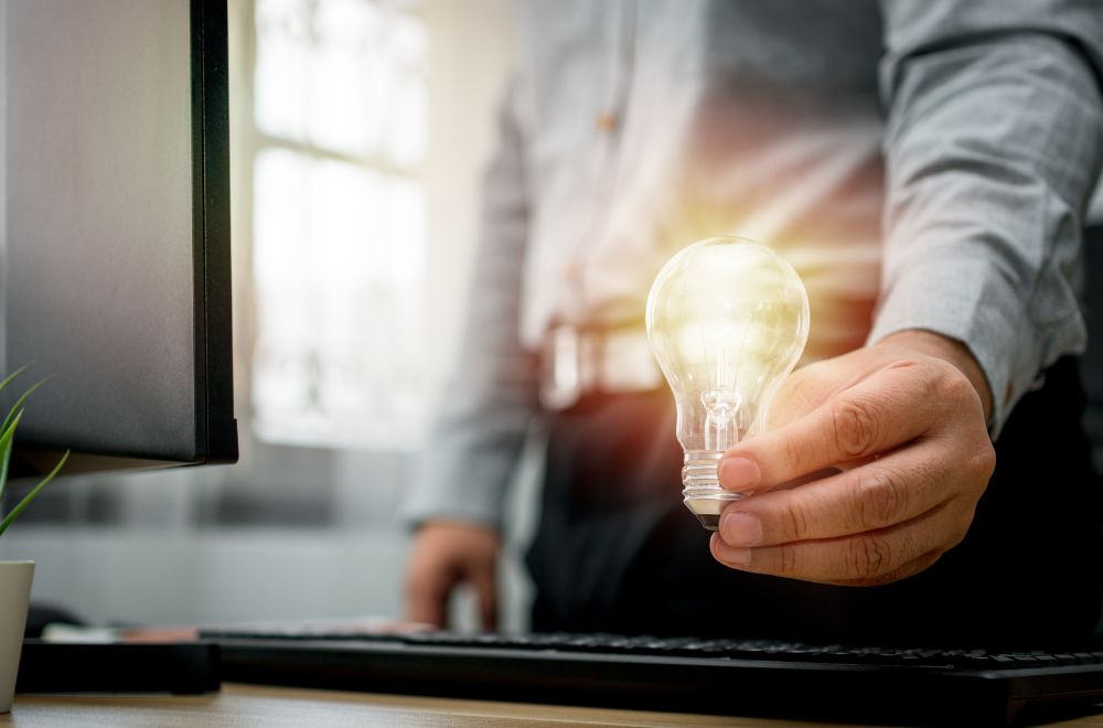 Businessman Holding Lightbulb