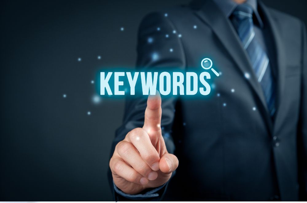 Businessman Pointing To Word &quot;Keywords&quot;