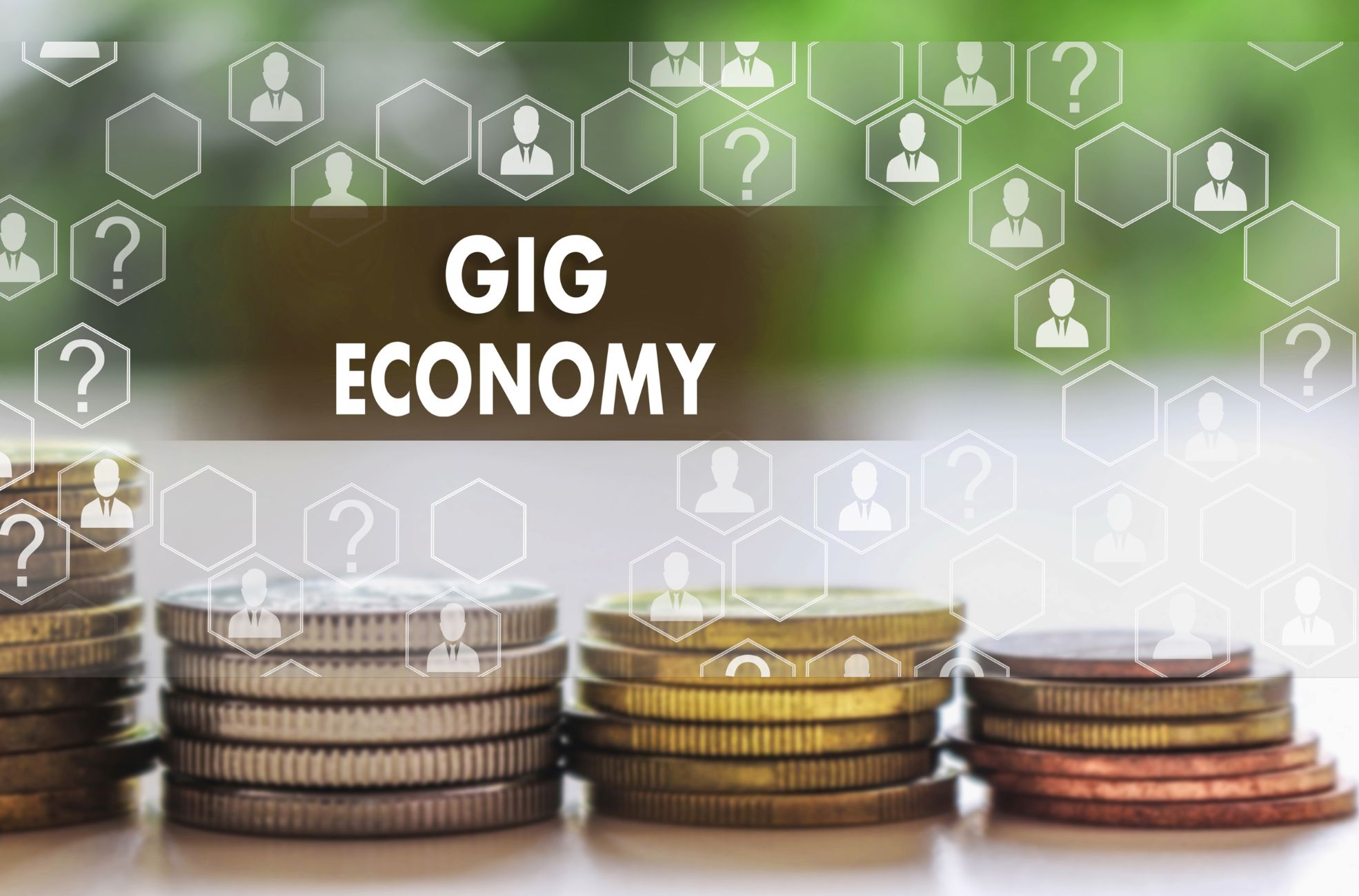 Coins And Title Saying &quot;Gig Economy&quot;