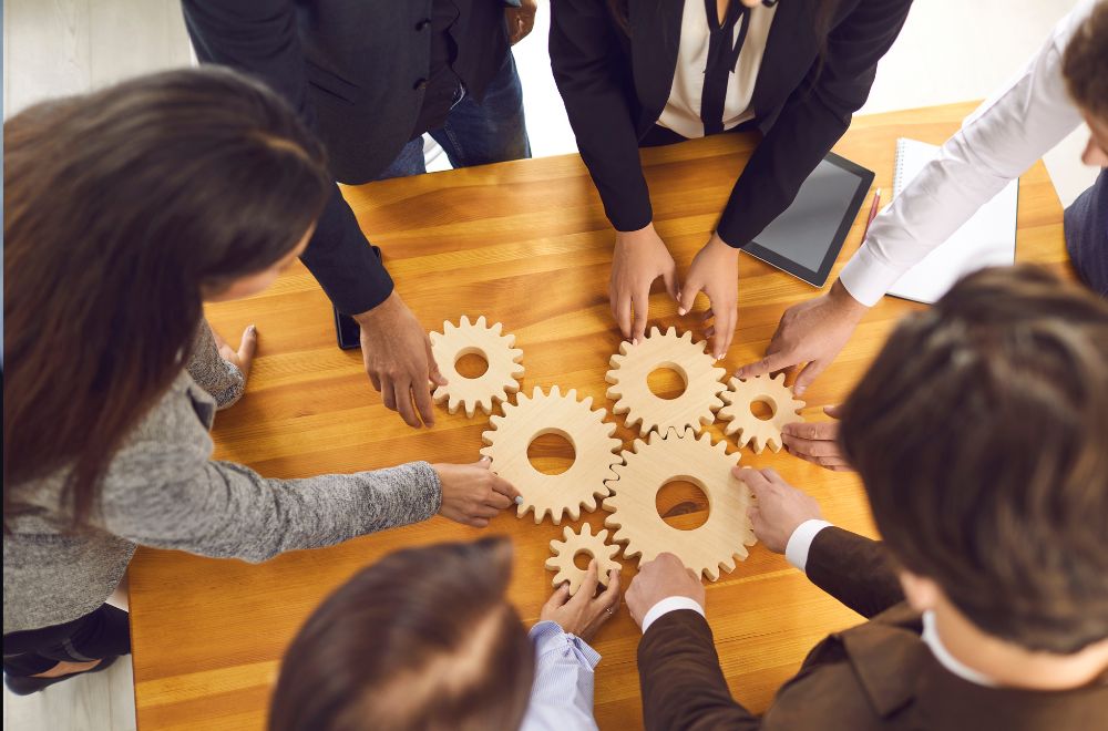 Team Members Working On Puzzle