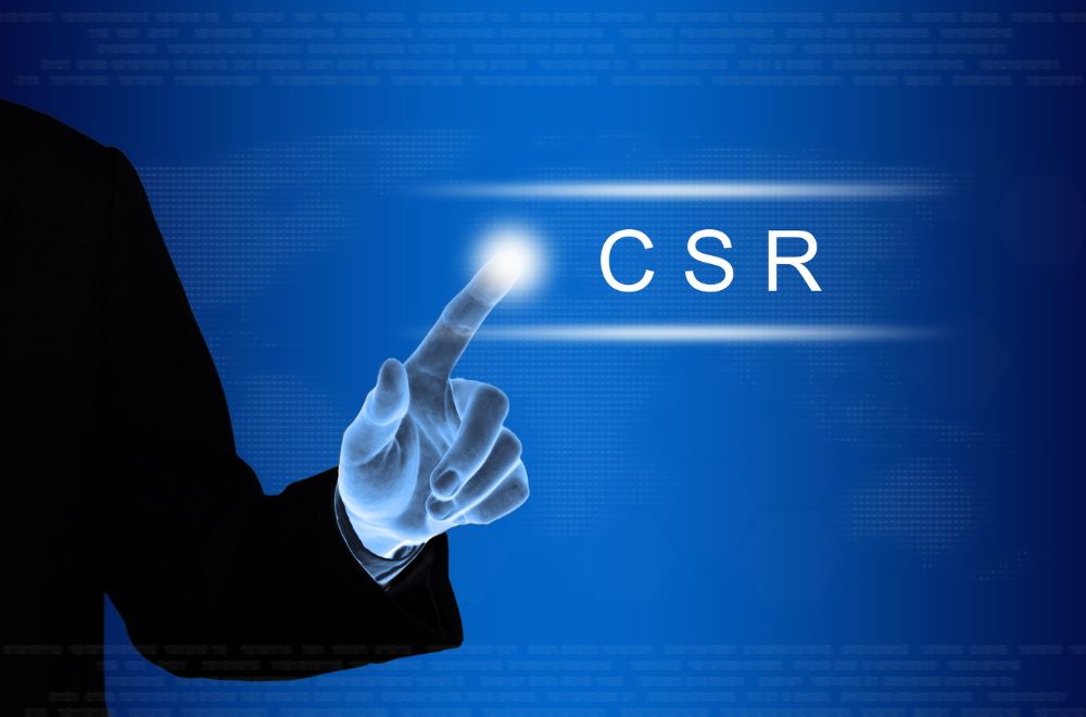 Business Man Pointing To CSR Sign