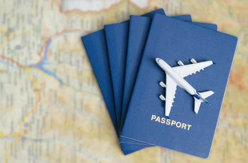 Plane And Passports On Map