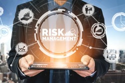 Businessman Holding Tablet With Risk Management Sign