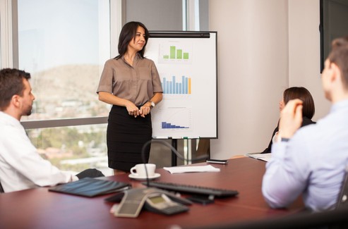 Woman Presenting A Pitch Deck