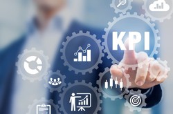 Businessman Pointing To Sign Saying KPI