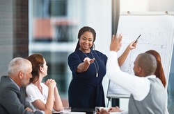 Woman Giving Feedback To Staff