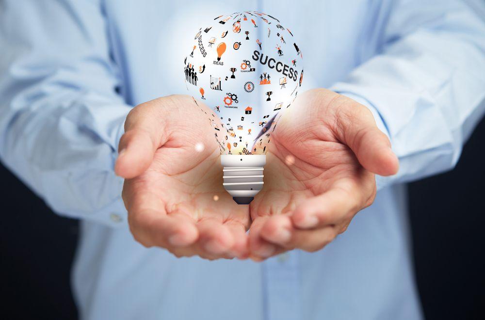 Businessman Holding Innovation Lightbulb Diagram