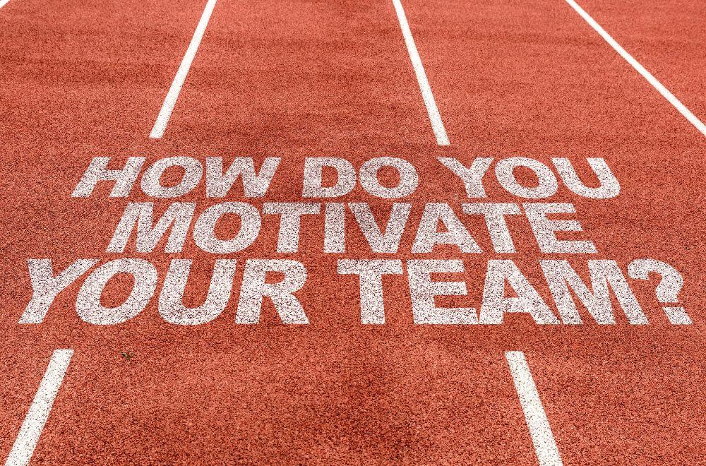 Track With Writing Saying "How Do You Motivate Your Team?"